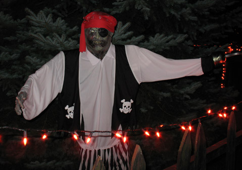 This is my pirate; pvc frame with a store-bought costume (on sale, of course).  I changed the mask this year, so he looks a bit more rotted than normal.