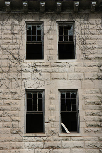 Here's a closer look at those windows.  I don't know which window this girl was seen at, but just about any of these could be it.  I would not be s uprised if a lot of sad, abused psych patients stared blankly at the streets below, languishing and longing to get out of there.